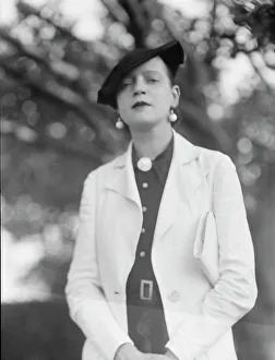 Leonard, Mrs. standing outdoors, between 1926 and 1938. Creator: Arnold Genthe