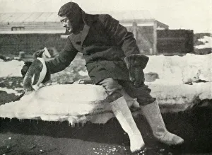 Penguin Prints: Lieut. Rennick and a Friendly Penguin, 1911, (1913). Artist: Herbert Ponting