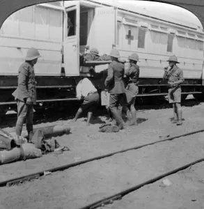 Stretcher Case Collection: Lifting wounded soldiers onto a hospital train, East Africa, World War I, 1914-1918.Artist