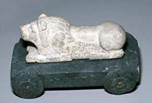 Patron Saint Prints: Limestone and bitumen lion mounted on a wheeled base, Susa, c12th century BC