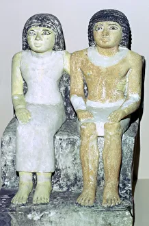 Limestone Egyptian statue of a man and his wife