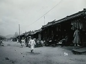 Store Prints: A line of shops beside a dusty street