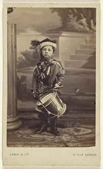 Percussion Instrument Prints: Little boy in uniform, 1870s. Creator: Jamin & Cie