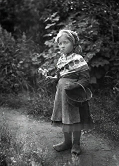 Shawl Collection: Little girl with basket and flowers in hands, 1898-1900. Creator: Johan Severin Nilson