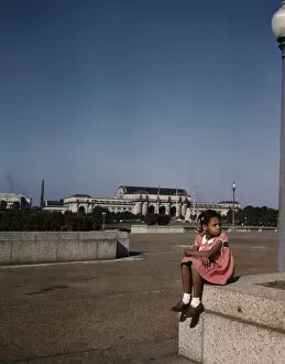 World War Two Gallery: Little girl in a park with Union Station in the background, Washington, D.C. ca. 1943