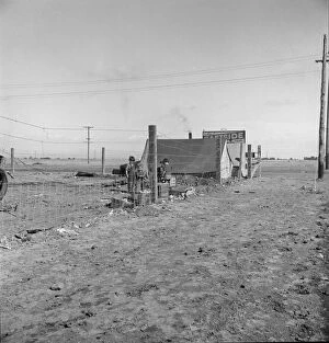 Barbed Wire Gallery: Living conditions for migratory laborers in private auto camp, Calipatria, Imperial County, 1939