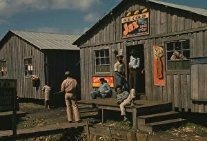 Living quarters and 'juke joint' for migratory workers, a slack season; Belle Glade, Fla., 1941