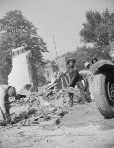 Loading debris from wrecked buildings along Independence Avenue, Washington, D. C, 1942. Creator: Gordon Parks