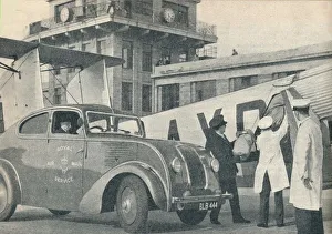 Loading mails on board an Imperial Airways liner at Croydon Airport, c1936 (c1937). Artist: GPO