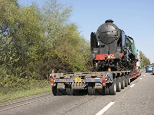 Commercial Vehicles Prints: Locomotive being transported by heavy goods vehicle on A31 2015. Creator: Unknown