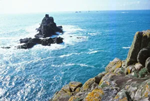 Longships Lighthouse and the Armed Knight, Lands End, Cornwall, 20th century. Artist: CM Dixon