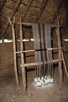 Iron Age Prints: Loom with chalk loom weights, Butser Iron Age Farm, c20th century. Artist: CM Dixon