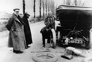 Chauffeur Prints: Lord Northcliffe's chauffeur changing a tyre, (c1908?)