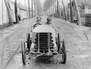 Muddy Prints: Lorraine Barrow at the wheel of a De Dietrich, Paris to Madrid Race, 1903