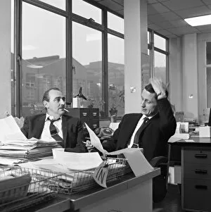 Administration Gallery: Lost order? two salesmen try to sort out the orders over a cigarette, 1967. Artist