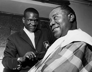 Hairdressing Collection: Louis Armstrong having haircut in Hammersmith, London, 1962. Creator: Brian Foskett