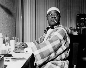 Relaxation Collection: Louis Armstrong relaxing backstage, Finsbury Park Astoria, London, 1962. Creator: Brian Foskett