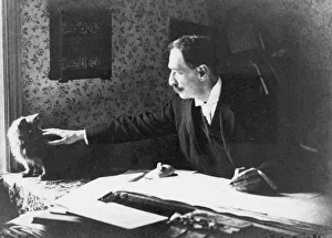Louis Wain at his drawing board, 1890s. Artist: Anonymous