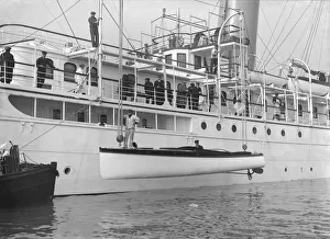 Lowering Libertys motor launch, 1914. Creator: Kirk & Sons of Cowes Lowering Libertys motor launch, 1914. Creator: Kirk & Sons of Cowes