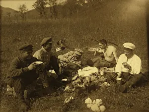 Caps Prints: Lunch at the halt. Group portrait, 1920-1929. Creator: Unknown