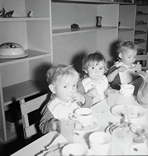 Lunchtime for young migrants at Shafter Camp, California, 1939. Creator: Dorothea Lange