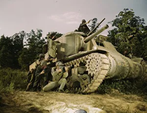 Military Base Prints: M-3 tank and crew using small arms, Ft. Knox, Ky. 1942. Creator: Alfred T Palmer