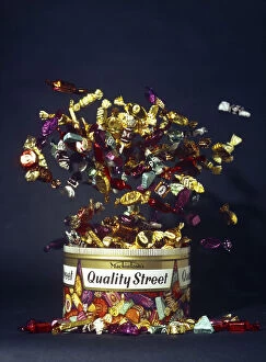 Confectionery Gallery: Mackintoshs Quality Street, exploding tin advertisment shot, 1972