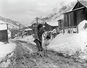 Muddy Prints: Main street, Utah coal town, Consumers, near Price, Utah, 1936. Creator: Dorothea Lange