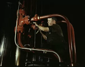 Combustion Engineering Corporation Gallery: Maintenance man at the Combustion Engineering Co. working at the largest...Chattanooga, Tenn. 1942