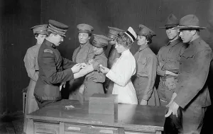 Typhoid Fever Prints: Major Connell inoculating woman motorist, 29 May 1917. Creator: Bain News Service