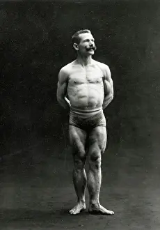 Anticipation Prints: A male bodybuilder wearing bathing trunks