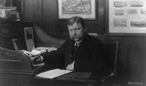 Man (banker?) seated at desk in American Security and Trust Co. Washington, D.C. c1890 - c1950. Creator: Frances Benjamin Johnston