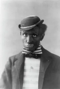 Blackface Prints: Man in blackface as minstrel, between c1890 and c1910. Creator: Frances Benjamin Johnston