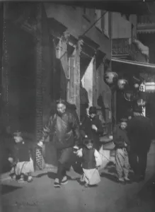 Lanterns Prints: Man and two boys walking along a street
