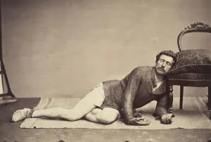 Constant Prints: [Man in Chainmail Tunic Posing as a Dying Soldier], ca. 1863. Creator: Constant Delessert