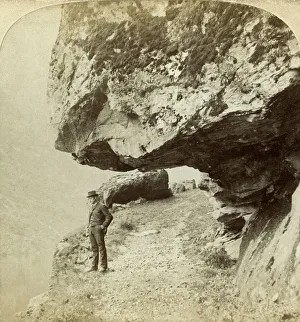 Bert Prints: Man on a cliff overlooking Naeroyfjord, Sogne, Norway. Artist: Bert Underwood