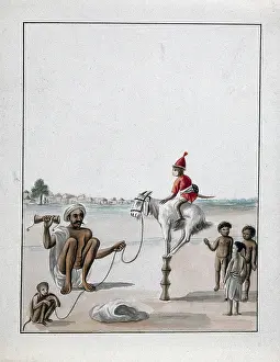 Crouching Prints: A man conducting a monkey show on the street