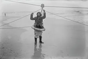 Pulley Prints: Man demonstrating ship rescue apparatus, 1919. Creator: Bain News Service