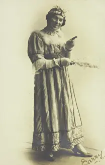 Cross Dressing Prints: A man in drag, holding a feather, performing in the play A country girl, 1920
