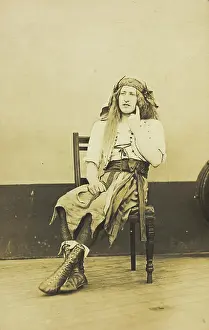 Hand On Chin Prints: A man in drag sits pensively on a chair