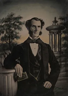 Watch Chain Prints: Man Holding Book, Standing Before a Painted Scenic Backdrop, 1850s-60s. Creator: Unknown