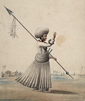Expressive Prints: A man holding a long arrow with two puppets (?) hanging from it