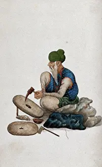 A man making grindstones, (between 1800 and 1899?). Creator: Unknown