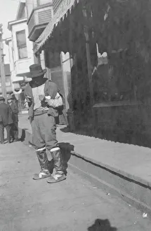 Nome Alaska United States Prints: Man outside store, between c1900 and 1916. Creator: Unknown