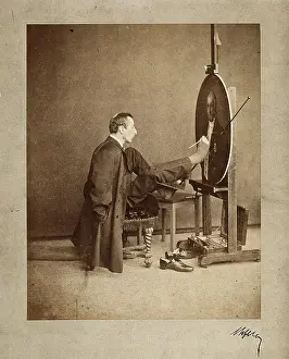 Easel Prints: A man painting an oval portrait using his feet, c1870. Creator: Joseph Dupont