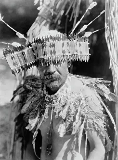 Pomo Prints: Man in Pomo dance costume, half-length portrait