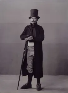 Edlund Helene Prints: A man poses in folk costume with a long coat and a top hat