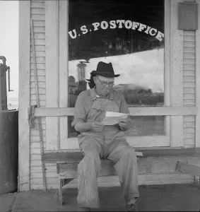 Workwear Prints: Man in front of post office, Carey, Texas, 1937. Creator: Dorothea Lange