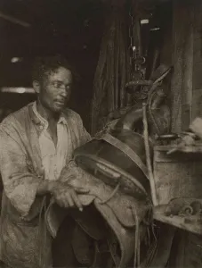 Clark Art Institute Prints: Man With A Saddle, c1920s. Creator: Doris Ulmann