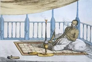 Hookah Collection: Man smoking a hookah of hashish or opium, pub. 1808-12. Creator: Franz Balthazar Solvyns